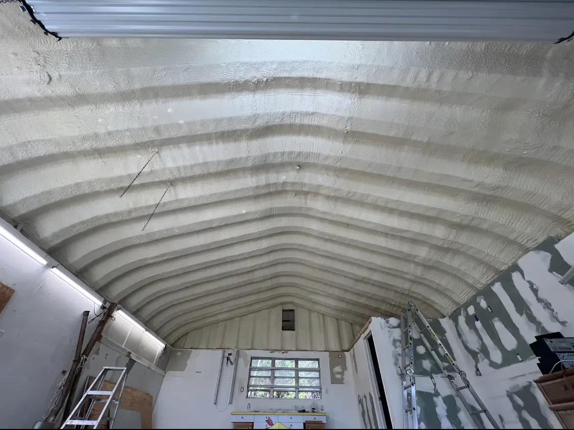 Spray polyurethane foam applied to the underside of a metal roof deck in Red Bluff